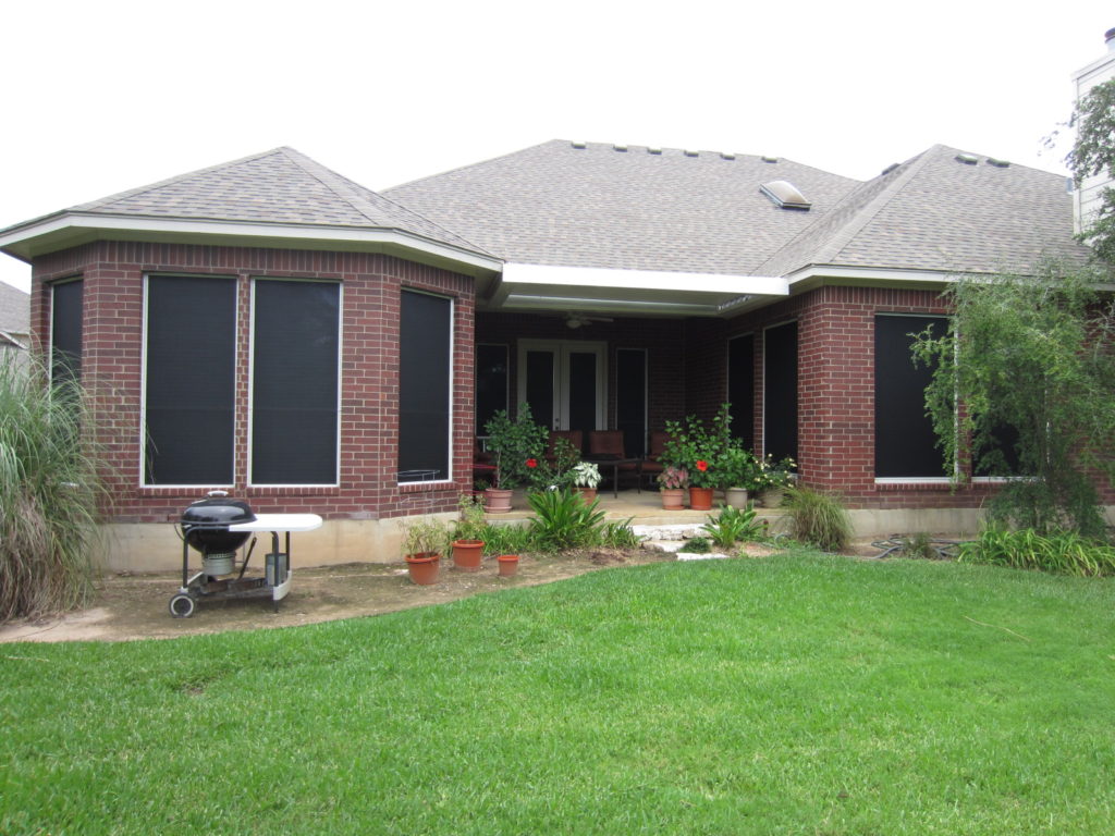 Austin TX sun shade solar screens deep within this patio.