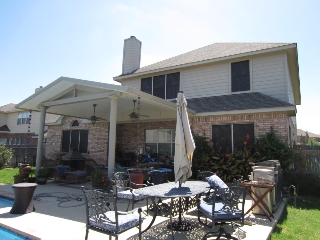 3 windows under patio covering that does not have solar sunshade screens installed on them. 