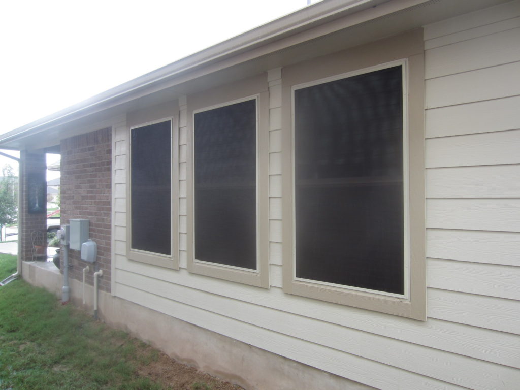 For this vinyl window solar screens installation, we installed three 80% solar window screens on the left side of this home.