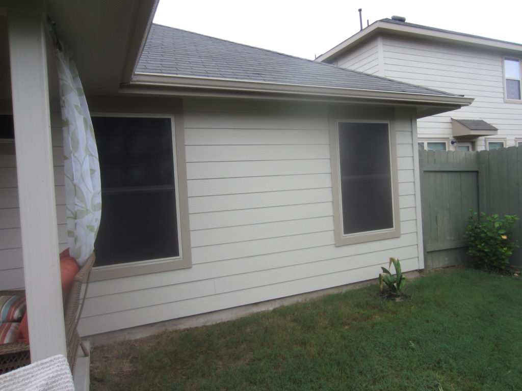 For this vinyl window solar screens installation, we installed four 80% solar window screens on the back side of this home. 