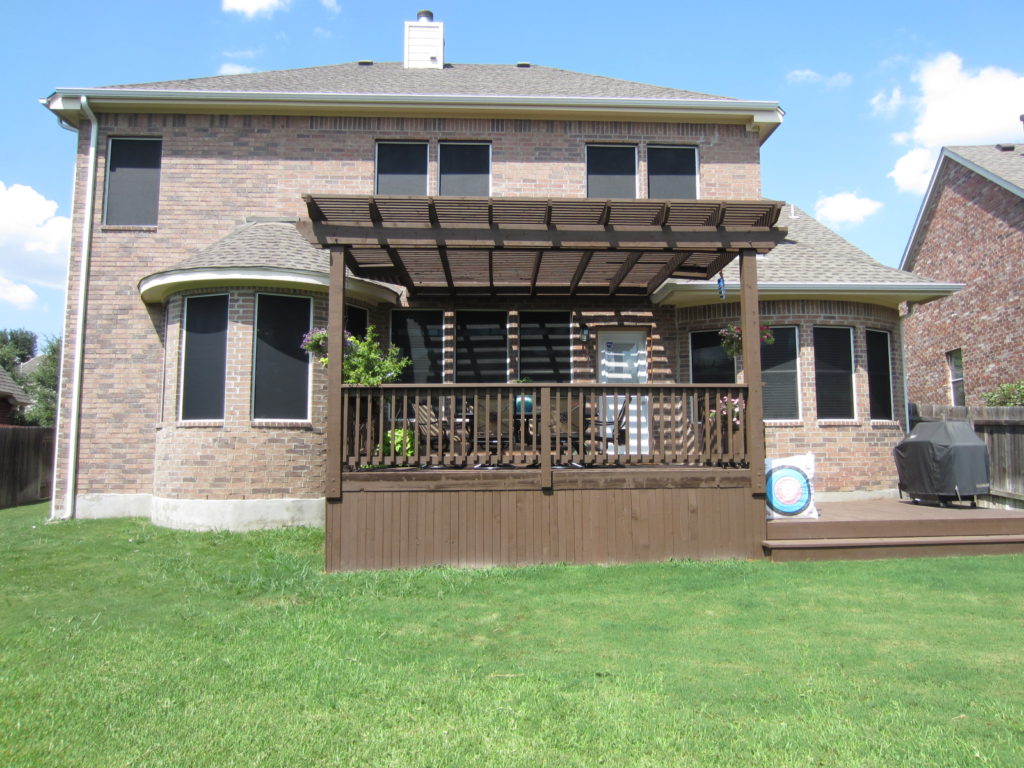 A home wearing 90% solar screens for all windows except the back patio door.