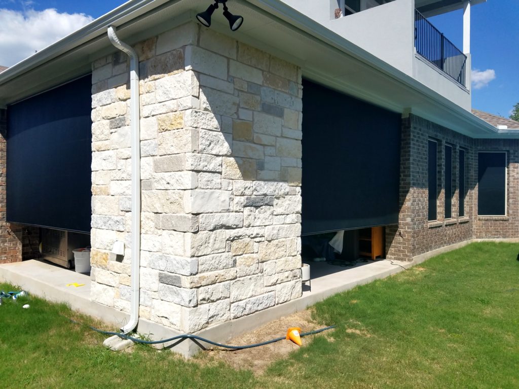 Two black 90% outdoor patio shades. Shading this Georgetown Texas patio.